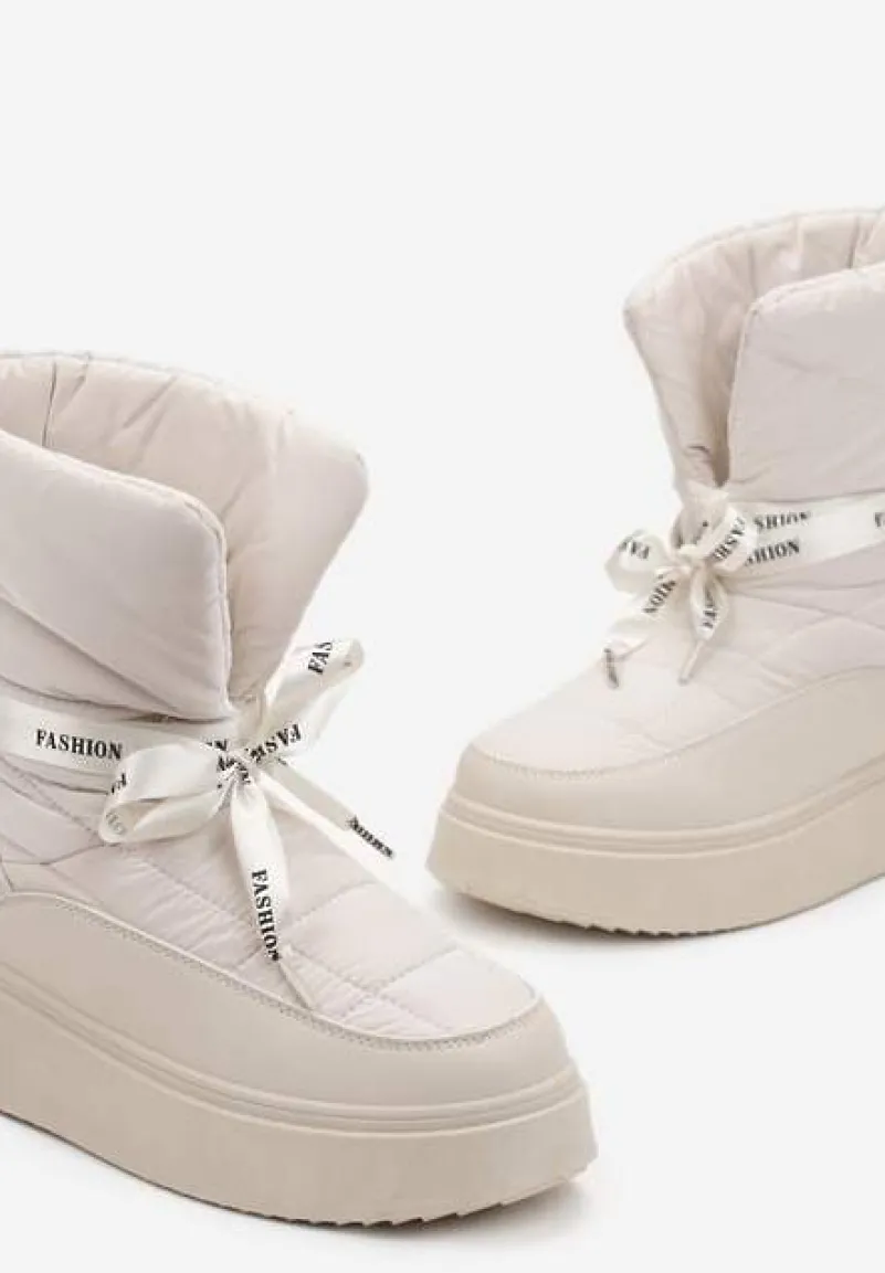 Beżowe Śniegowce z Ozdobną Wstążką Wokół Kostki Rohessi