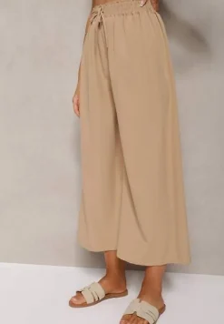 Beżowe Spodnie High Waist z Szerokimi Nogawkami z Wiskozą Wykończone Gumką w Talii Crisantas