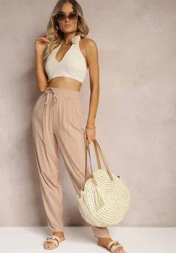 Beżowe Wiskozowe Spodnie z Gumką w Talii i Zwężanymi Nogawkami Sumipaku