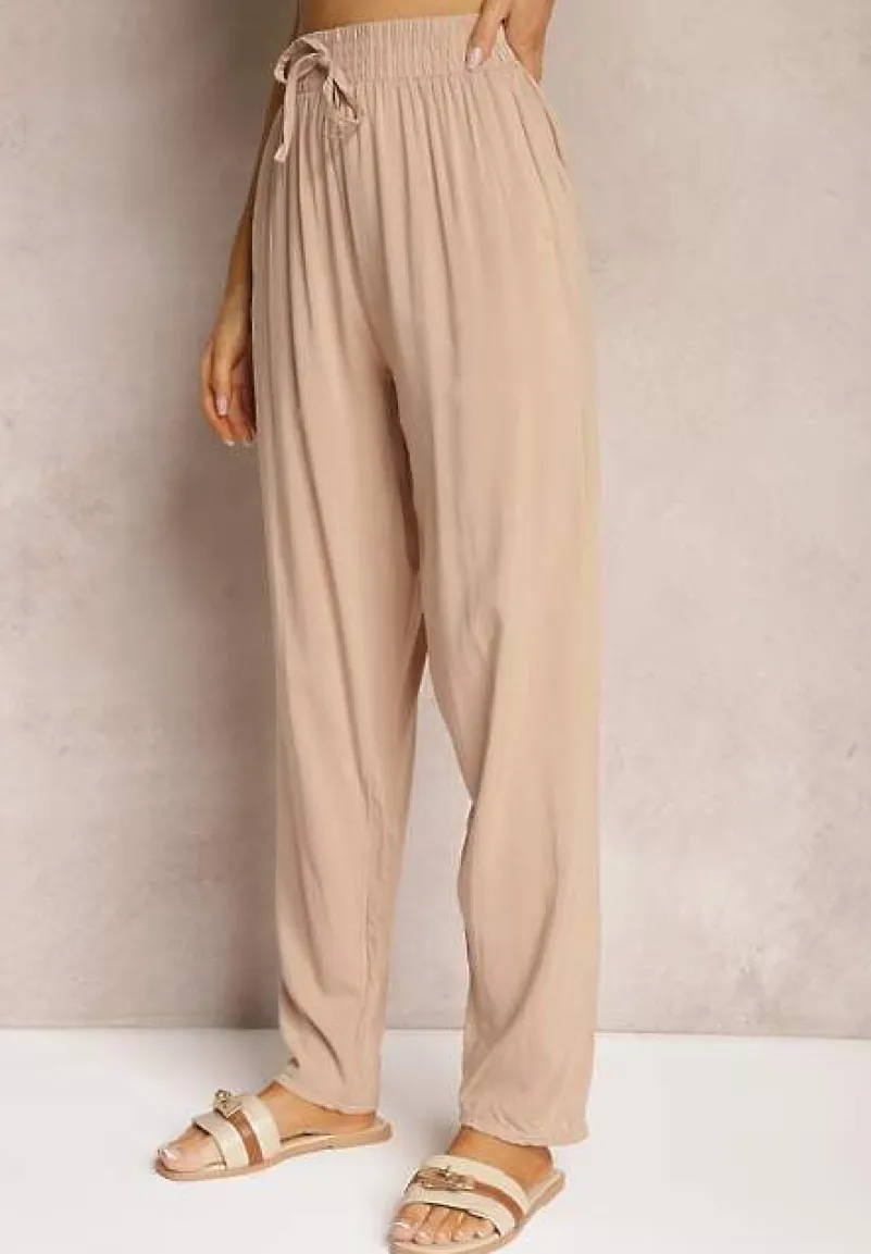 Beżowe Wiskozowe Spodnie z Gumką w Talii i Zwężanymi Nogawkami Sumipaku