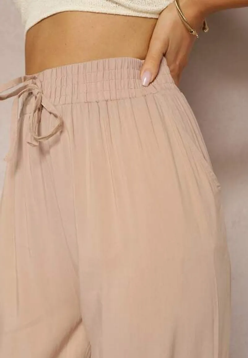 Beżowe Wiskozowe Spodnie z Gumką w Talii i Zwężanymi Nogawkami Sumipaku