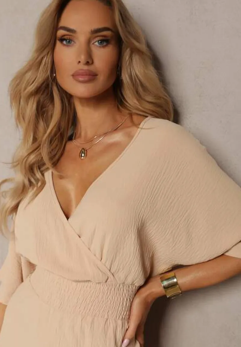 Beżowy Kombinezon o Kopertowym Fasonie z Szerokim Luźnym Dołem i Kieszeniami Octoni