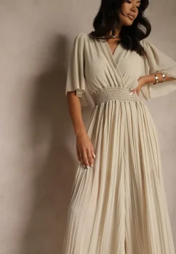 Beżowy Kombinezon z Kopertowym Dekoltem i Gumką w Pasie Zdobiony Plisami Amadle