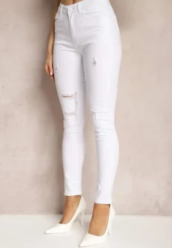 Białe Skinny Jeansy Ozdobione Dziurami i Przetarciami Riloevi