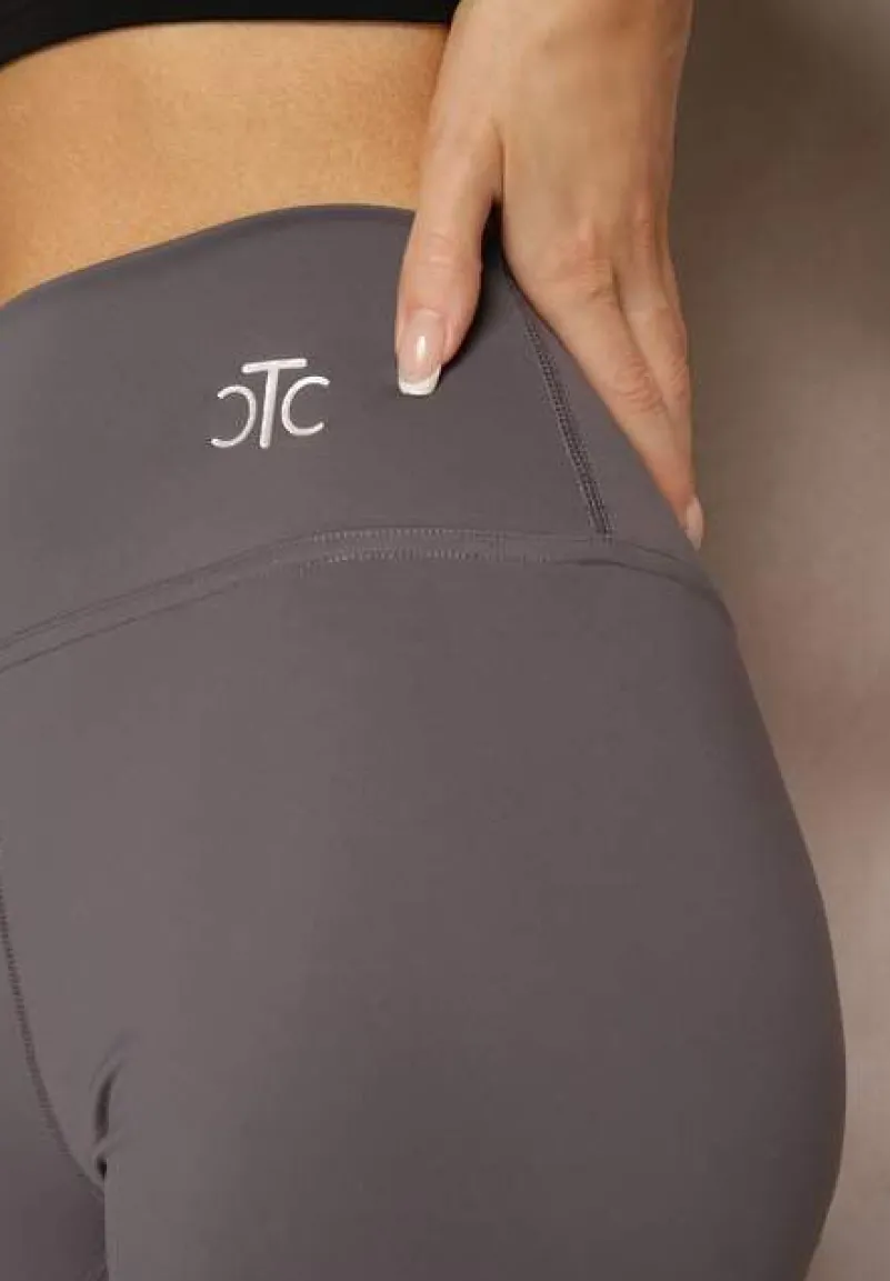 Ciemnoszare Sportowe Legginsy High Waist z Małym Ozdobnym Znaczkiem Lerilane