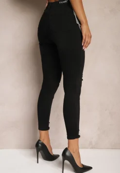 Czarne Jeansy z Łańcuszkiem w Komplecie Ozdobione Dziurami Tiidana