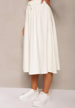 Jasnobeżowa Spódnica o Rozkloszowanym Kroju Ściągana w Pasie Rigelia