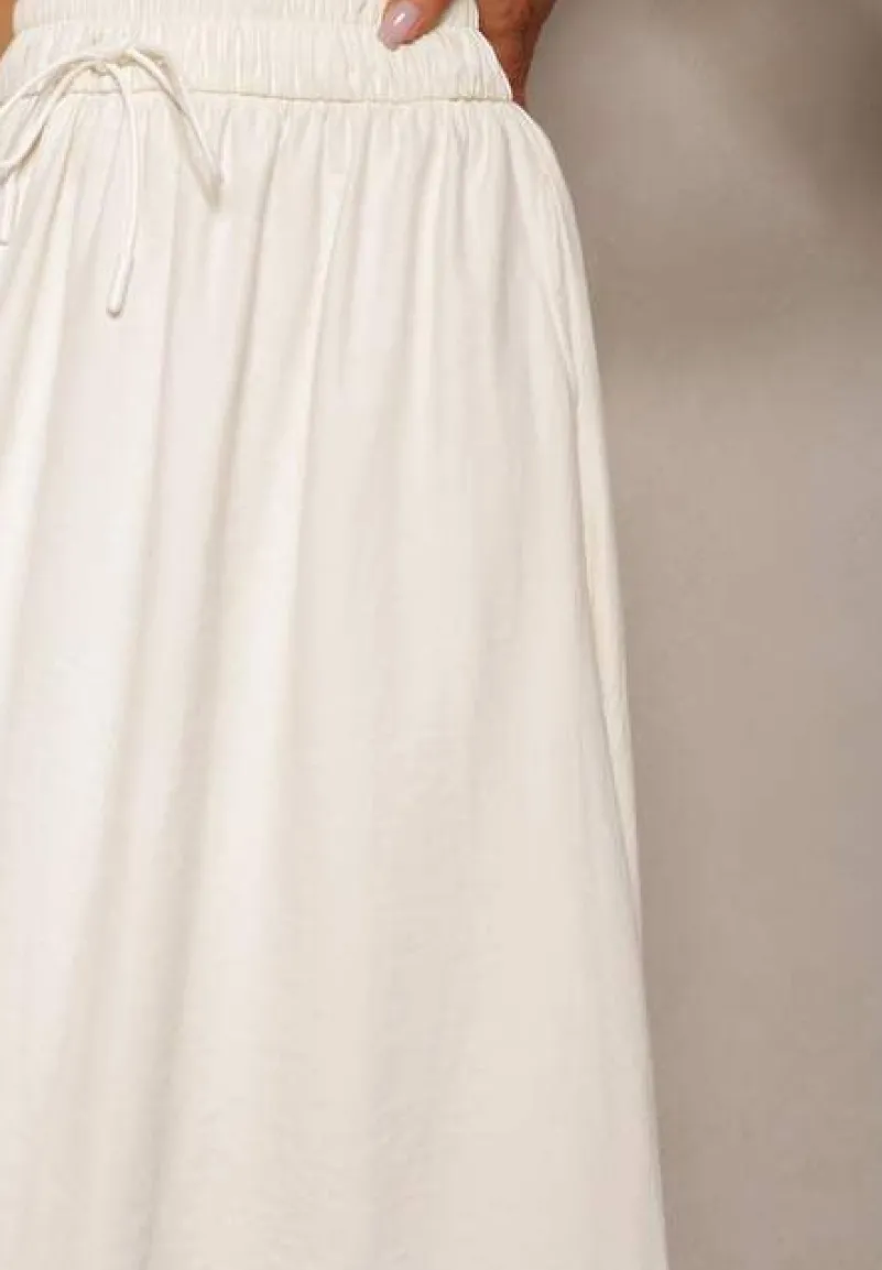 Jasnobeżowa Spódnica o Rozkloszowanym Kroju Ściągana w Pasie Rigelia