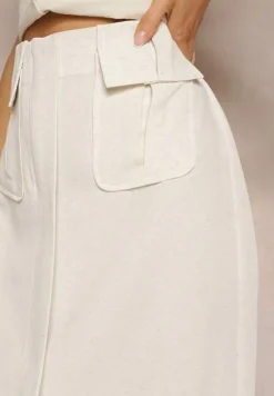 Jasnobeżowa Spódnica o Trapezowym Kroju Ozdobiona Kieszeniami i Rozcięciem Nestanie