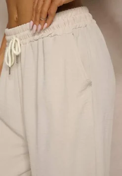 Jasnobeżowe Spodnie High Waist ze Sznurkiem w Talii i Prostą Nogawką Raveann