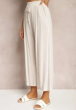 Jasnobeżowe Spodnie z Bawełny Typu Palazzo z Gumką w Talii Fieana