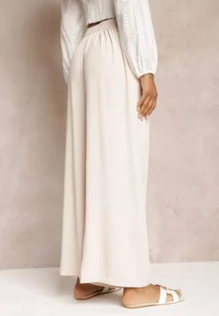 Jasnobeżowe Spodnie z Szerokimi Nogawkami i Doszytym Paskiem w Talii Atita