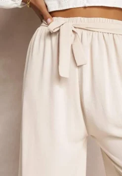 Jasnobeżowe Spodnie z Szerokimi Nogawkami i Doszytym Paskiem w Talii Atita