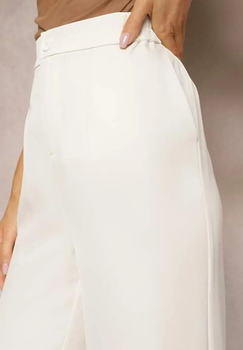 Jasnobeżowe Spodnie z Szeroką Prostą Nogawką Wykończone Gumką w Pasie Zapinane na Zamek Błyskawiczny Sonoria