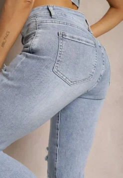 Jasnoniebieskie Jeansy z Prostymi Nogawkami i Przetarciami Atwilia