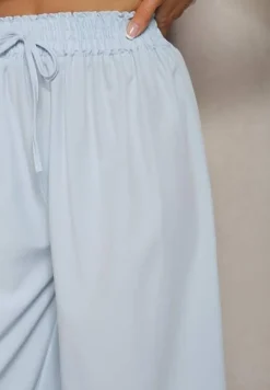 Jasnoniebieskie Spodnie High Waist z Szerokimi Nogawkami z Wiskozą Wykończone Gumką w Talii Crisantas