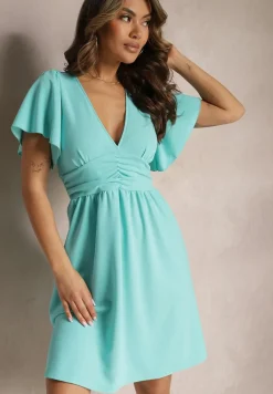 Niebieska Sukienka z Rozkloszowanym Dołem i Ozdobnymi Przeszyciami Celarsa