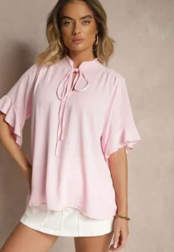 Różowa Bluzka z Falbanami i Wiązaniem Fadeassa